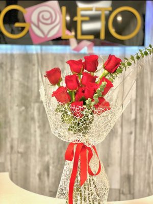Gift wrapped bouquet of 12 classic red roses symbolizing passion and love, hand-arranged for the perfect expression of affection to your special someone